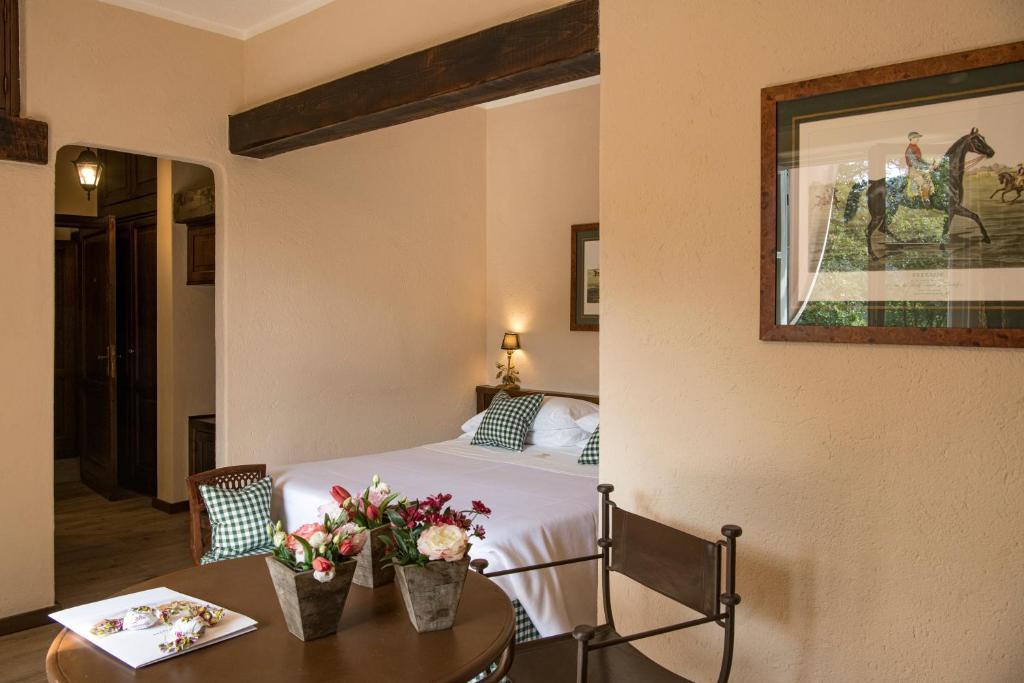 Posteľ alebo postele v izbe v ubytovaní La Meridiana ReIais & Chateaux