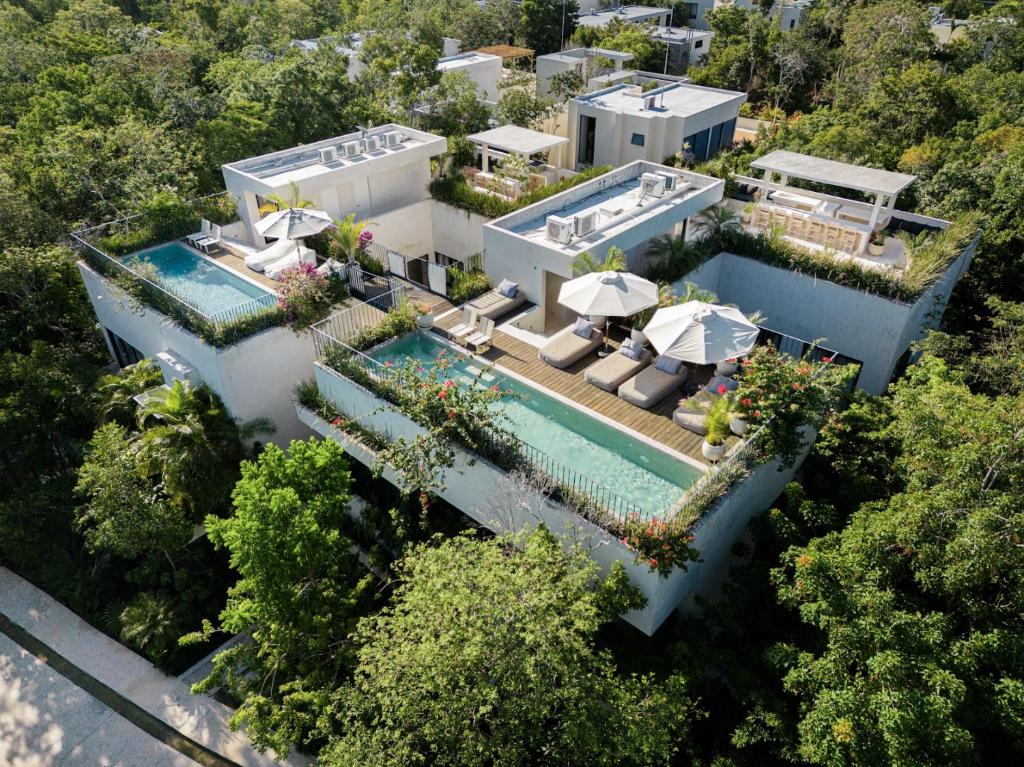 an aerial view of a house with a swimming pool at Jashita Tulum Luxury Villas in Tulum