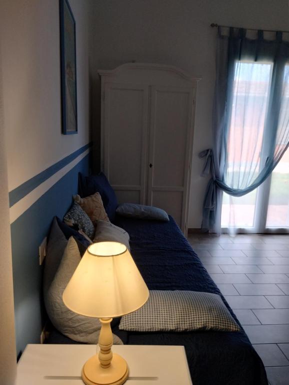Postel nebo postele na pokoji v ubytování B&B La Dolce Riva