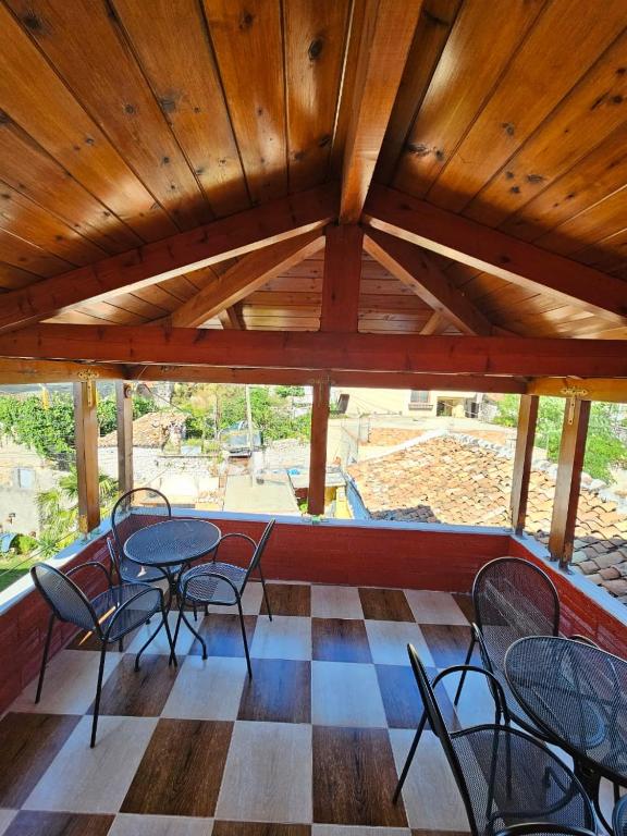 a room with tables and chairs in a building at Castle - inside,Voga Guesthause in Krujë