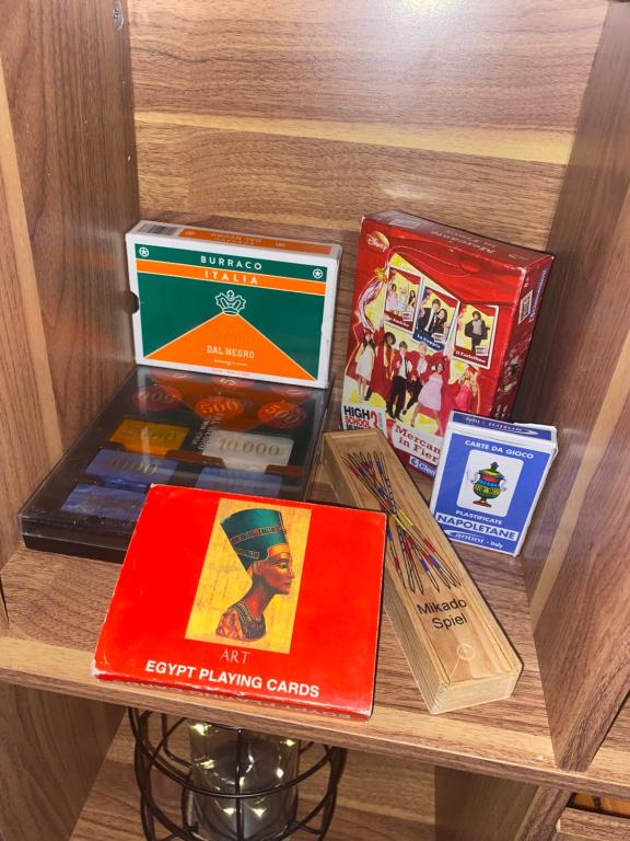 a shelf with four books on a book shelf at Il Casaletto in Gavignano