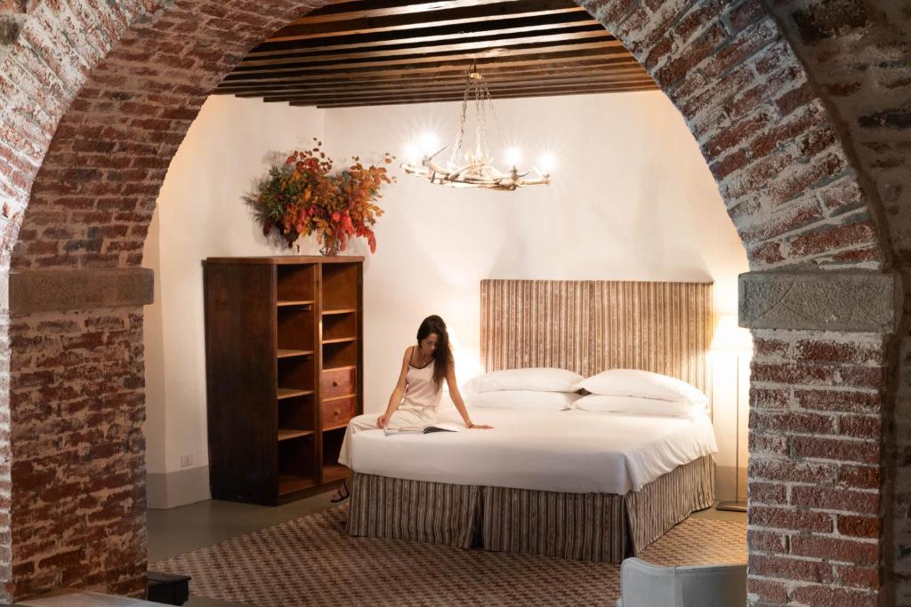 Postel nebo postele na pokoji v ubytování Castello di Buttrio