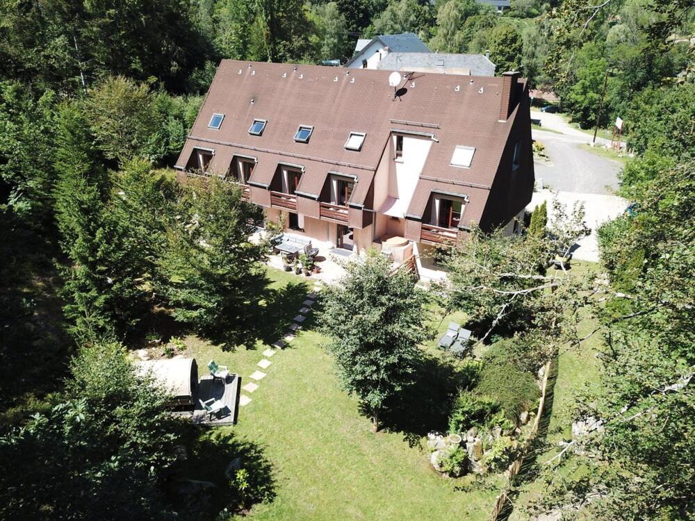 an aerial view of a large house in the trees at Coté Forêt in Orbey