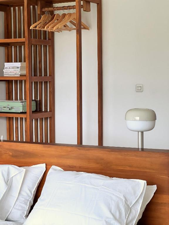 Postel nebo postele na pokoji v ubytování Kayom Rooms