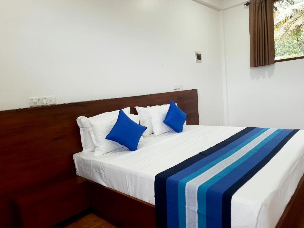 Postel nebo postele na pokoji v ubytování Hemalie Resort Mirissa
