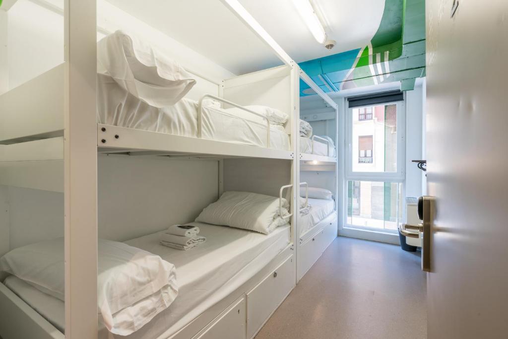 Postel nebo postele na pokoji v ubytování Ganbara Hostel - Self Check In
