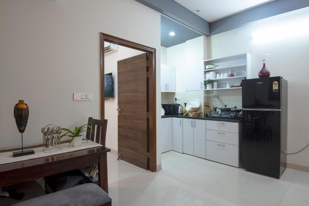 Kuchyň nebo kuchyňský kout v ubytování BedChambers Serviced Apartment, Medicity