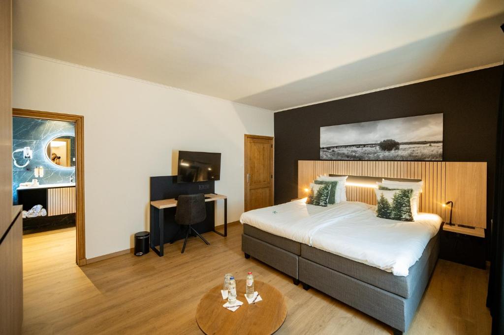 Postel nebo postele na pokoji v ubytování La Villa des Fleurs