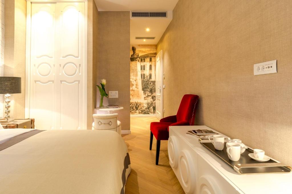 Postel nebo postele na pokoji v ubytování Procurator 7 Luxury Rooms