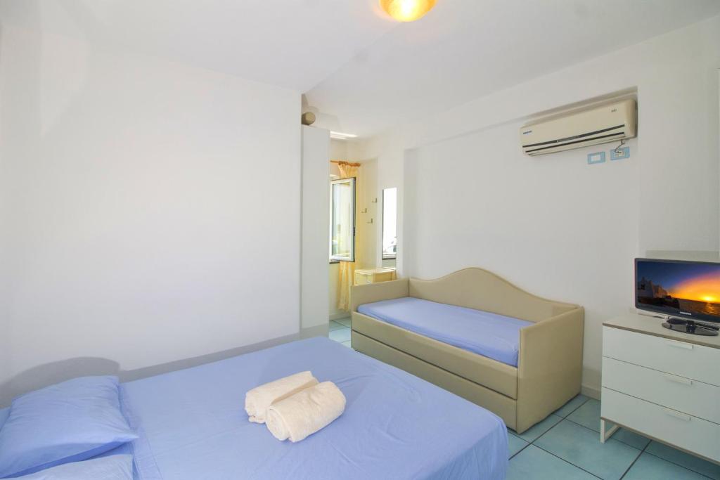 Postel nebo postele na pokoji v ubytování La Turrita Apartments