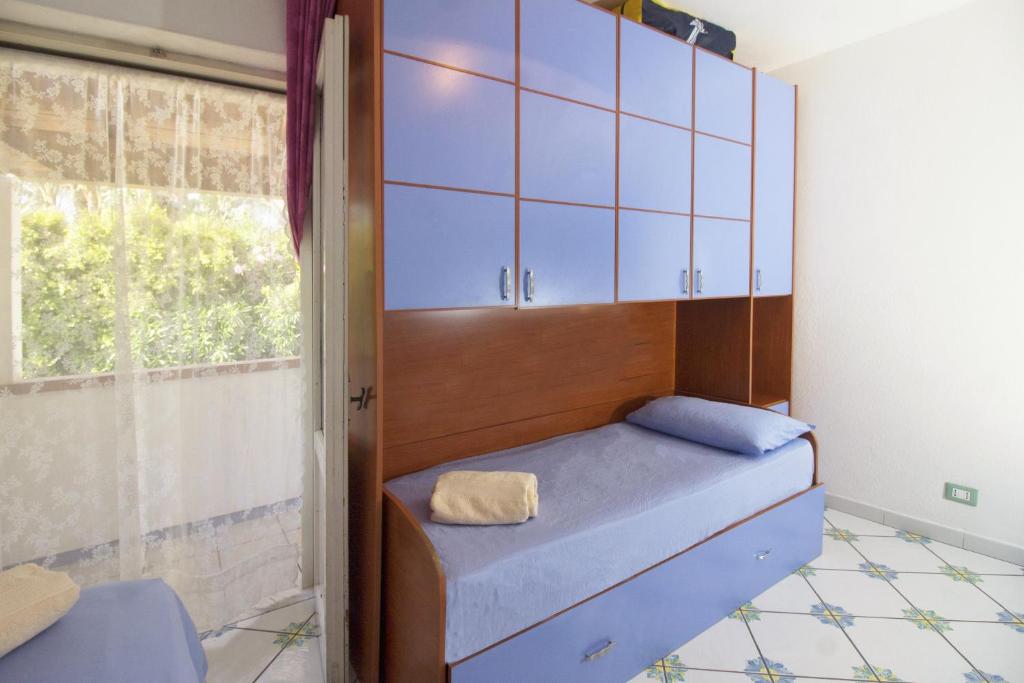 Postel nebo postele na pokoji v ubytování La Turrita Apartments