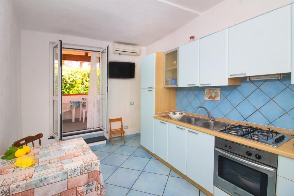 Kuchyň nebo kuchyňský kout v ubytování La Turrita Apartments