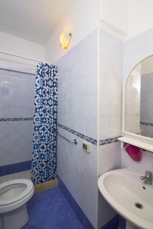 Koupelna v ubytování La Turrita Apartments