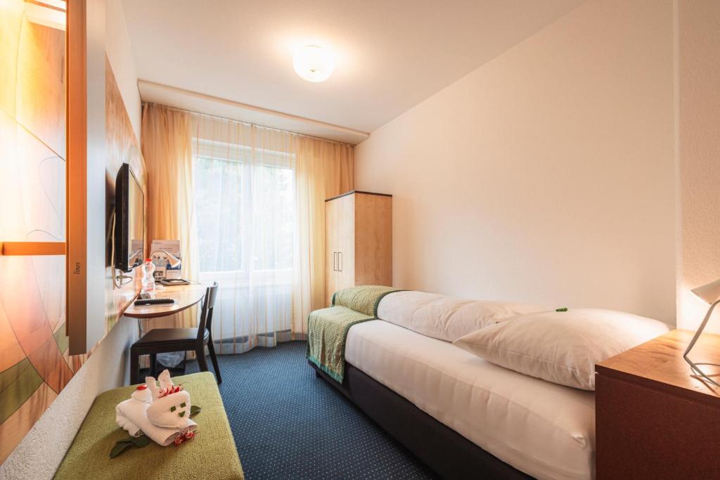 Postel nebo postele na pokoji v ubytování Hotel Seehof Superior