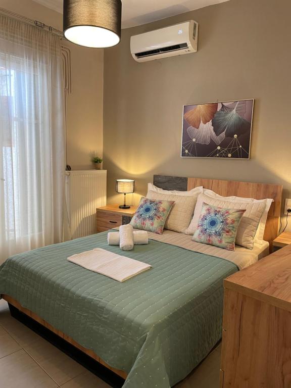 Posteľ alebo postele v izbe v ubytovaní Skiathos home