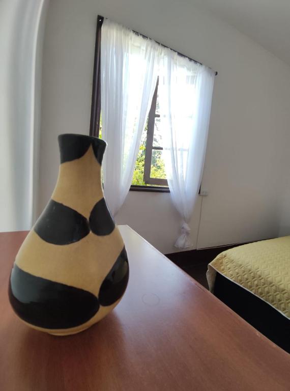 Postel nebo postele na pokoji v ubytování Hostal prado colonial
