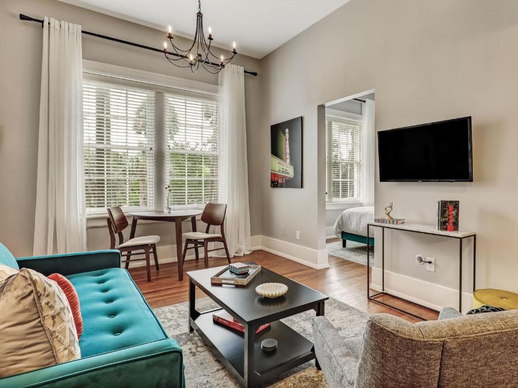 a living room with a couch and a table at The Haywood in Savannah