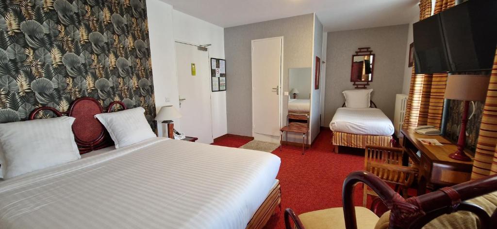 Postel nebo postele na pokoji v ubytování Brit Hotel Essentiel Pontivy Robic