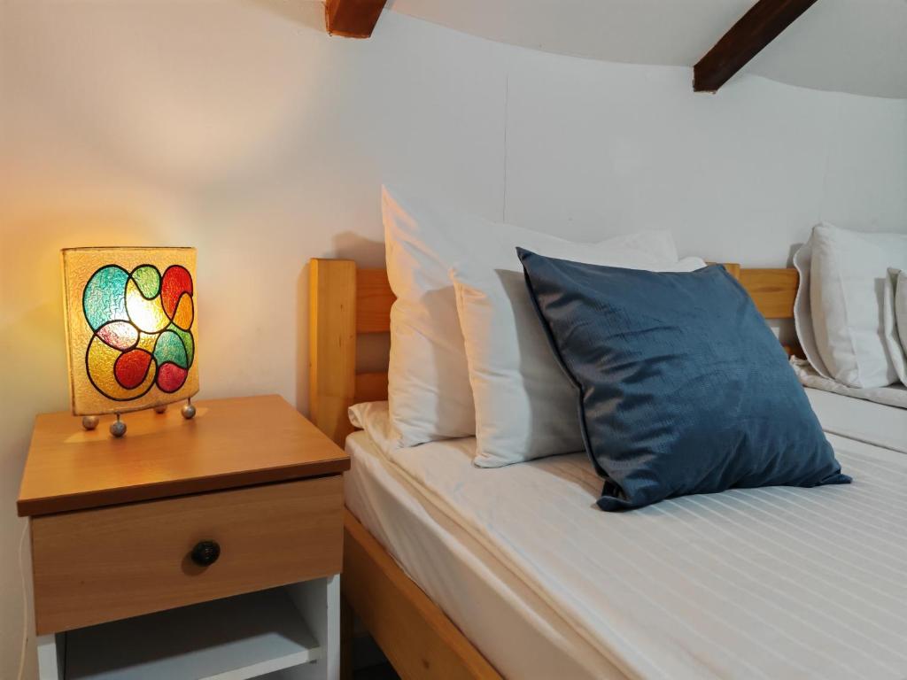 Postel nebo postele na pokoji v ubytování Apartmani Todorovic