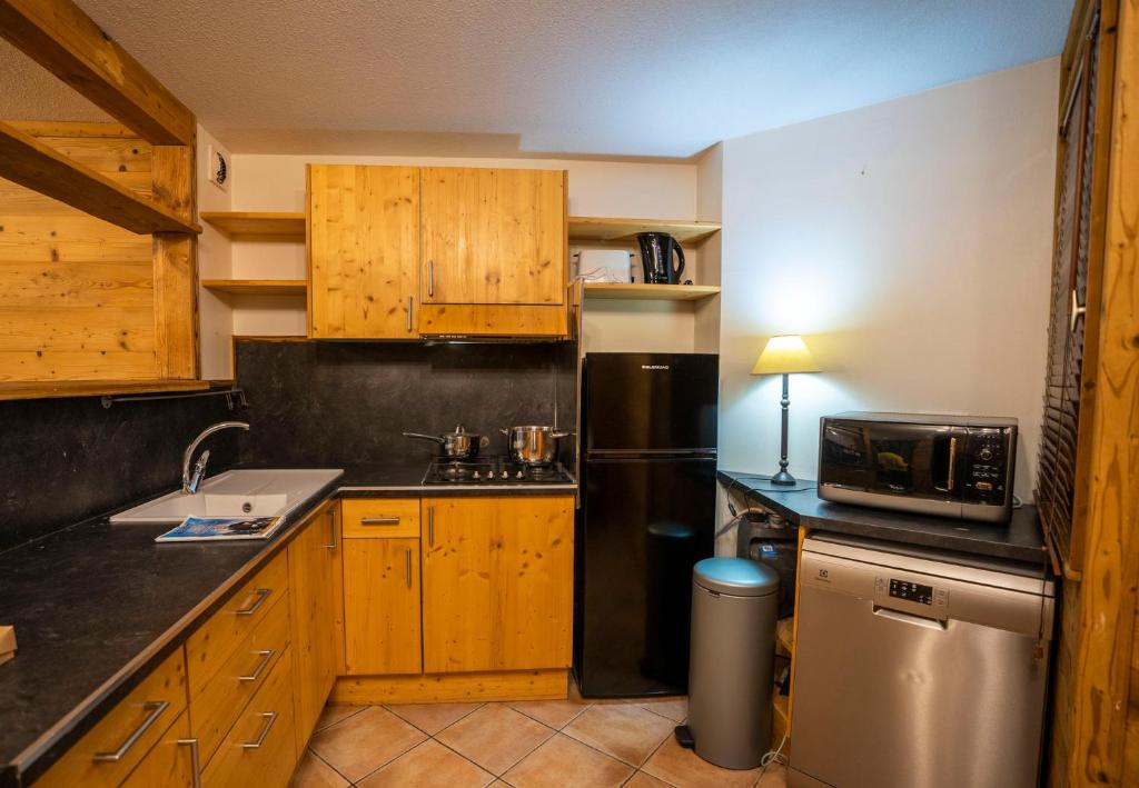 Kuchyň nebo kuchyňský kout v ubytování Peclet Appartements VTI