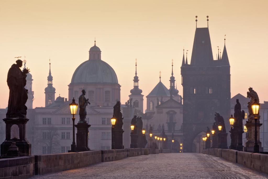 a view of a city with lights and buildings at BoHo Prague Hotel - Small Luxury Hotels in Prague