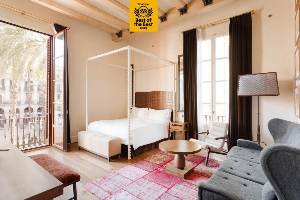 a hotel room with a bed and a table and chairs at DO Plaça Reial powered by Sonder in Barcelona