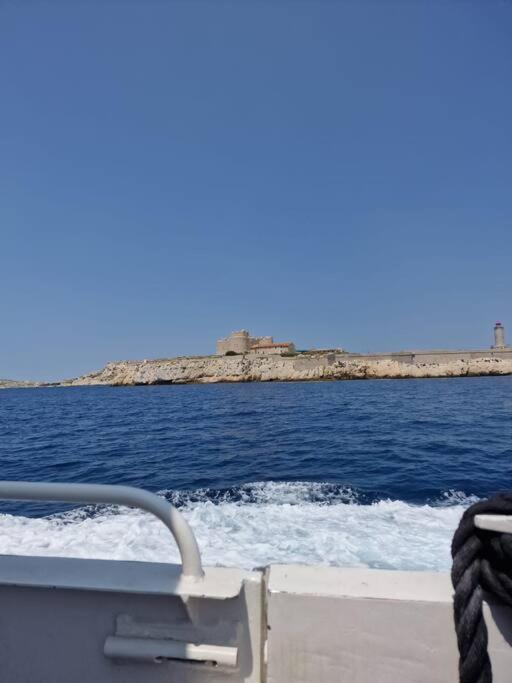 a boat in the water with a view of the ocean at Une parenthèse au Frioul in Marseille