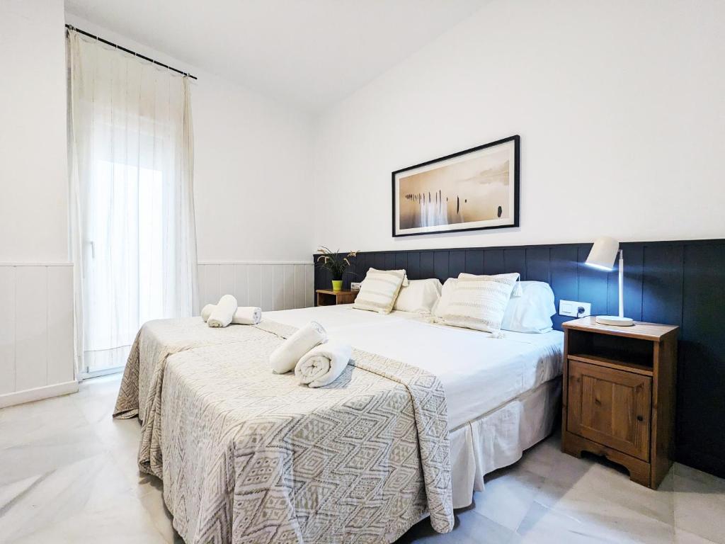 Posteľ alebo postele v izbe v ubytovaní San Marcos Apartamentos