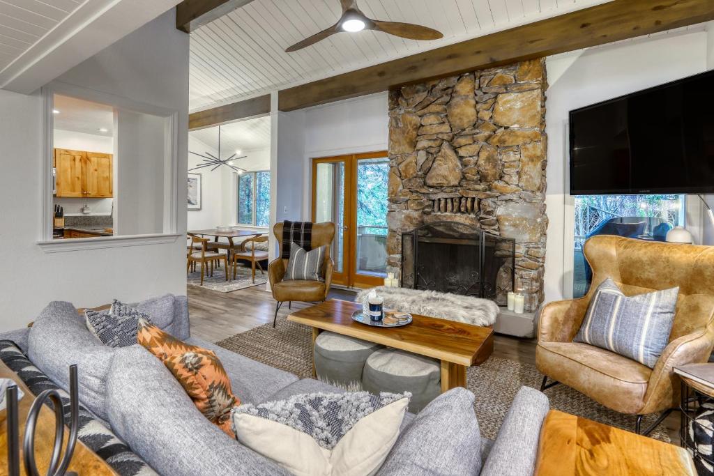 a living room with a couch and a fireplace at Inviting Tahoe Escape in Incline Village