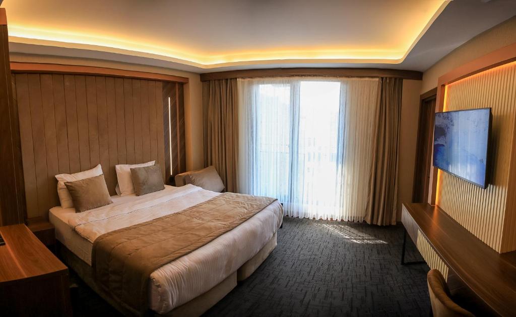 Postel nebo postele na pokoji v ubytování THE PARK HOTEL