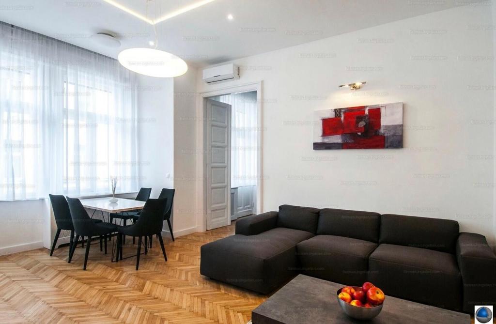 a living room with a couch and a table at Downtown Dimond in Budapest