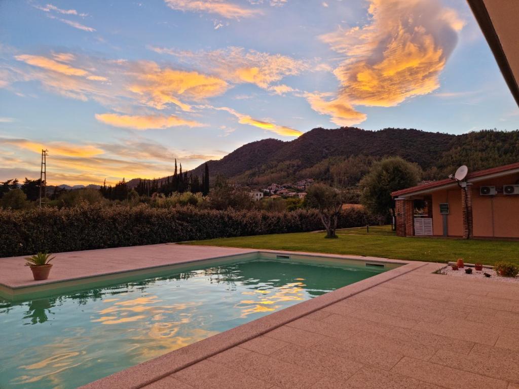 a swimming pool with a view of a mountain at Agriturismo Sa Jana Holidays - Adults Only in Cardedu
