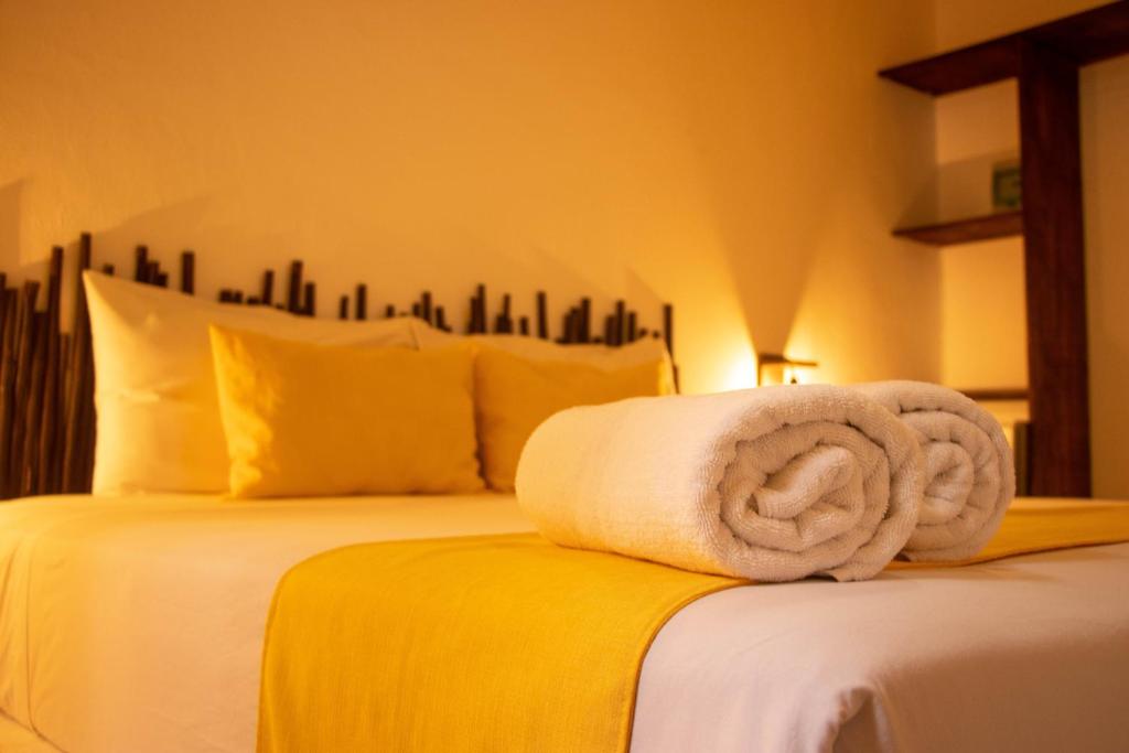 Postel nebo postele na pokoji v ubytování Hotelito El Cuyo