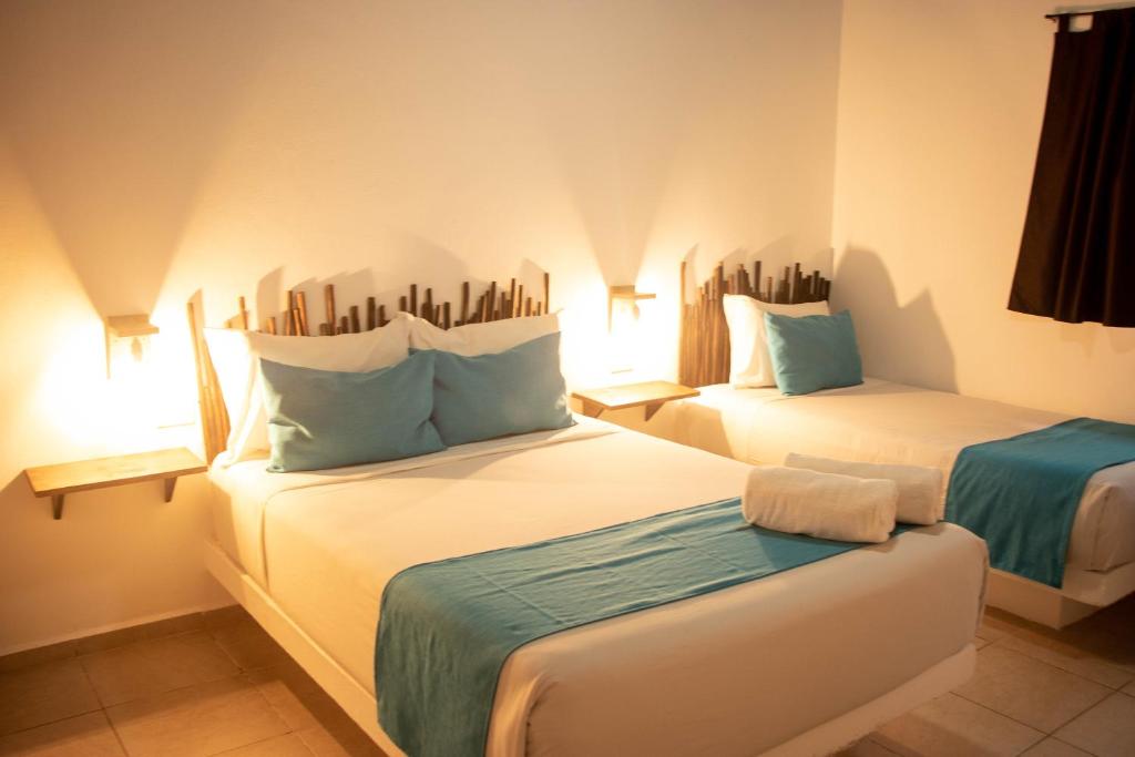 Postel nebo postele na pokoji v ubytování Hotelito El Cuyo