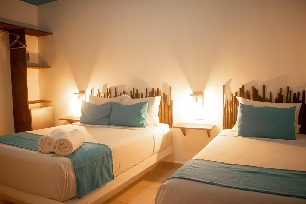 Postel nebo postele na pokoji v ubytování Hotelito El Cuyo