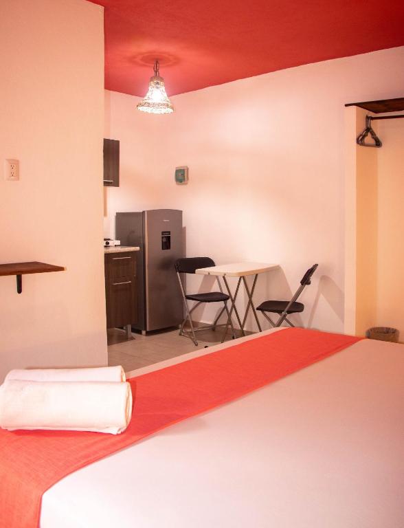 Postel nebo postele na pokoji v ubytování Hotelito El Cuyo