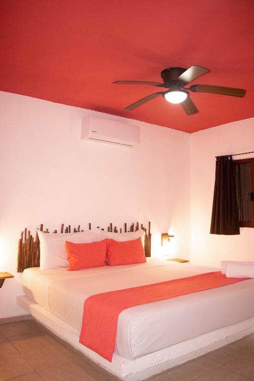 Postel nebo postele na pokoji v ubytování Hotelito El Cuyo