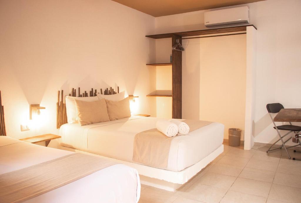 Postel nebo postele na pokoji v ubytování Hotelito El Cuyo