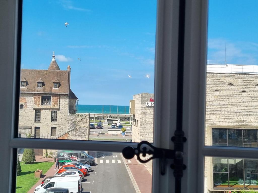 a view from a window of a parking lot at MUTUM - Studios 2 personnes, idéalement placés à 100m de la plage in Dieppe