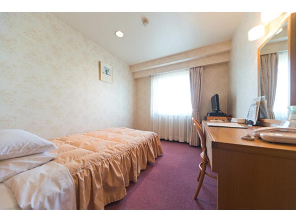 En eller flere senger på et rom på Hotel Socia - Vacation STAY 53771v