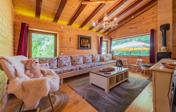 a living room with a couch and a table at Holiday Home Lika Mazin in Gračac