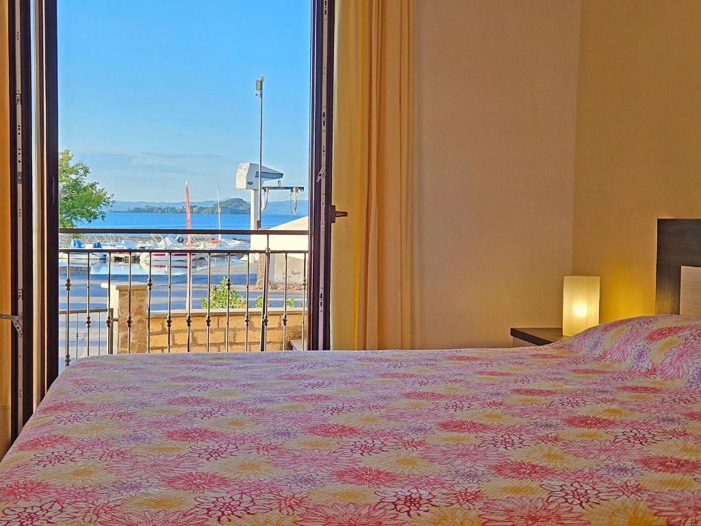 Postel nebo postele na pokoji v ubytování Terrazza Vista Lago