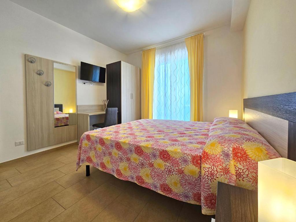 Postel nebo postele na pokoji v ubytování Terrazza Vista Lago