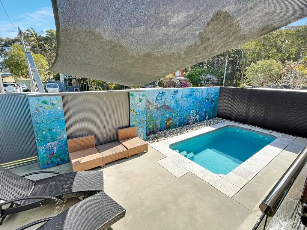 a swimming pool on the roof of a house at Baan Talay in North Haven
