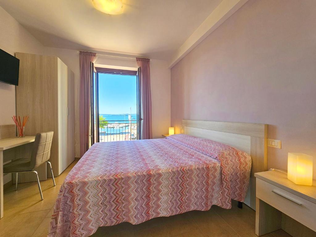 Postel nebo postele na pokoji v ubytování Terrazza Vista Lago