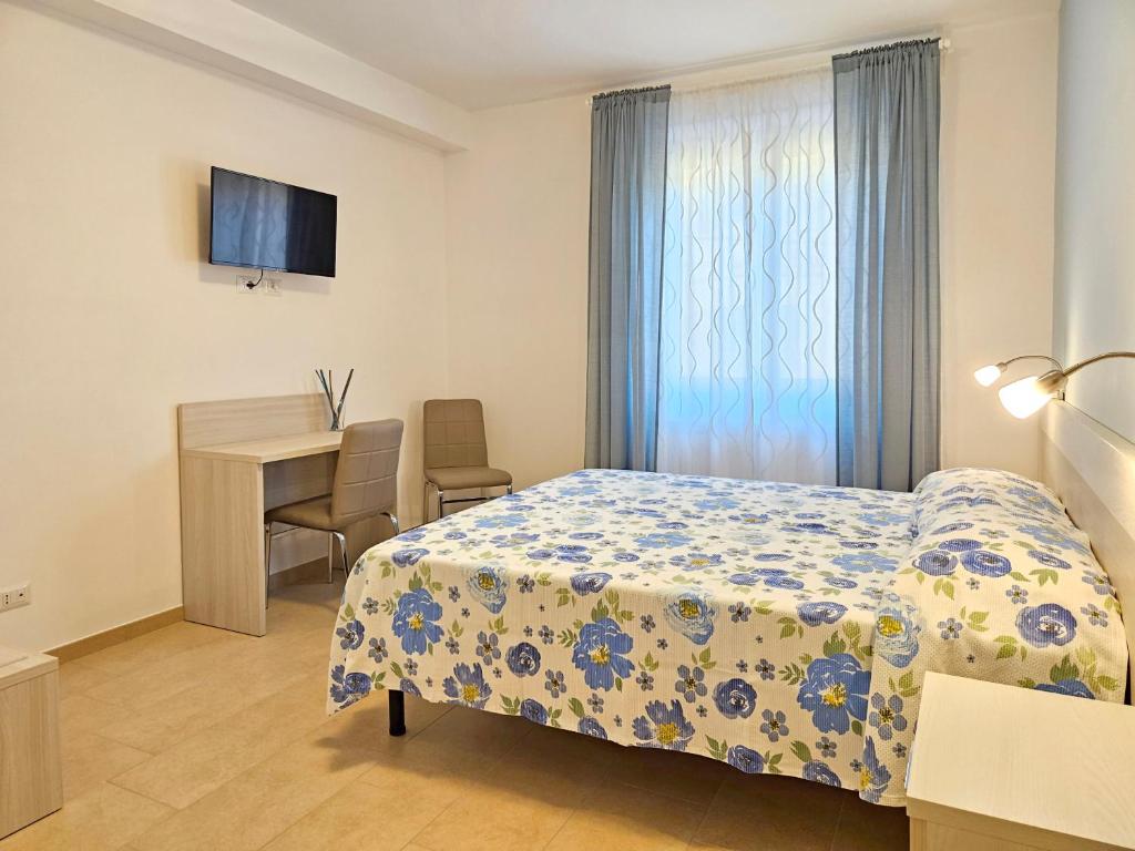 Postel nebo postele na pokoji v ubytování Terrazza Vista Lago
