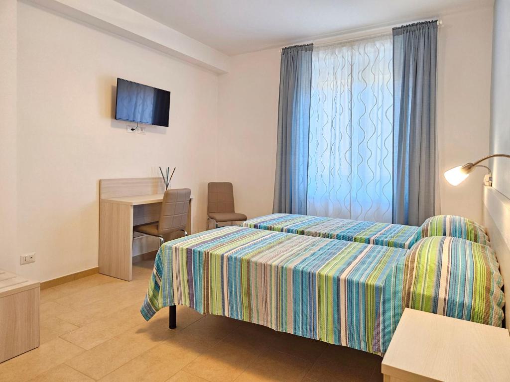 Postel nebo postele na pokoji v ubytování Terrazza Vista Lago