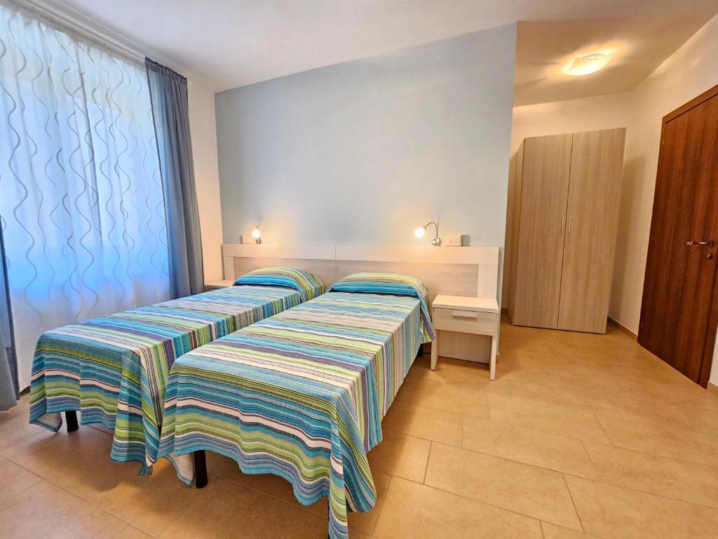 Postel nebo postele na pokoji v ubytování Terrazza Vista Lago
