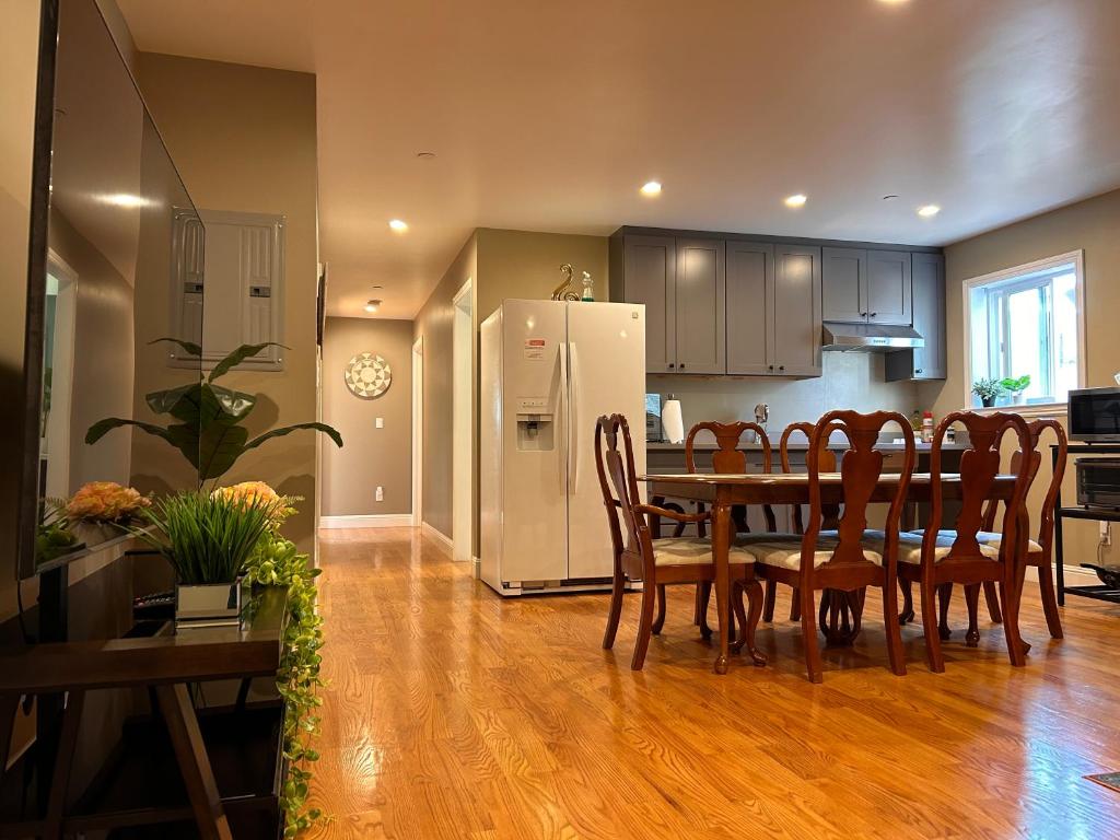 a kitchen and dining room with a table and chairs at San Francisco 3BR3BA w free parking near airport in Daly City