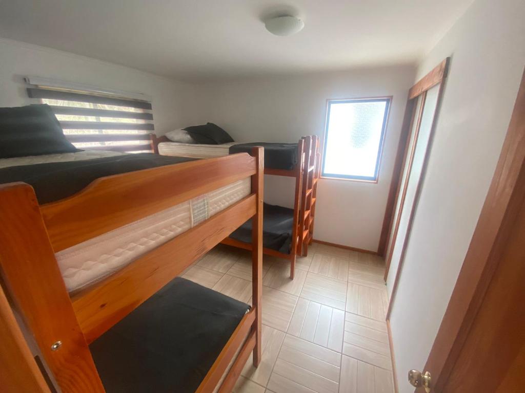 Cama o camas de una habitación en Cabañas Lomas de Ensenada